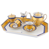 Set with "cobalt-blue borders and brocade decoration"