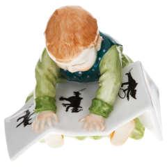 Child sitting with book, Coloured, without gold, H 10 cm