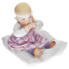 Child sitting on pillow, Coloured, without gold, H 12,5 cm