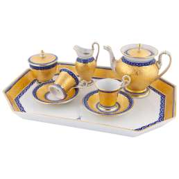 Set with "cobalt-blue borders and brocade decoration"